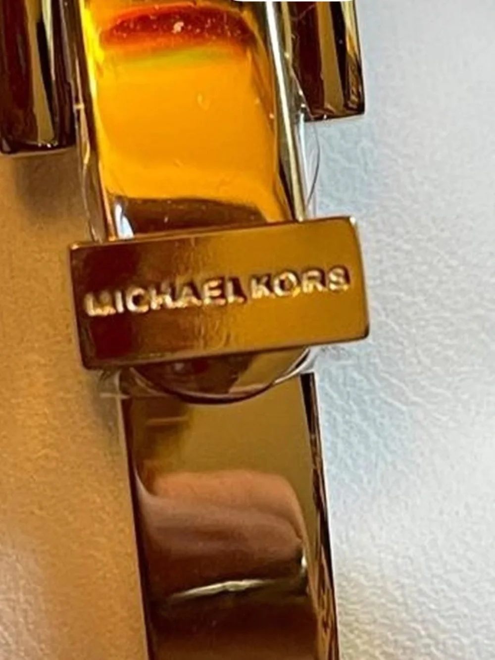 Michael Kors Gold Tone Hinged Logo Bracelet